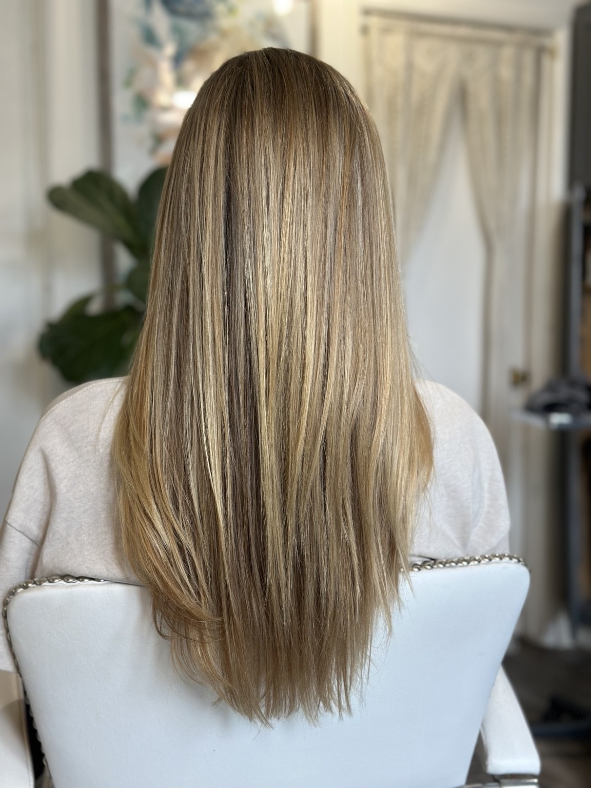 Smooth blonde hair with softly blended color and long, full lengths, hair by Brandy Michele
