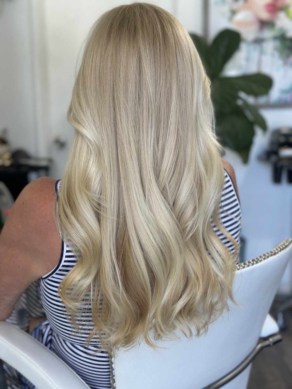 Pale blonde color with soft waves, hair by Brandy Michele