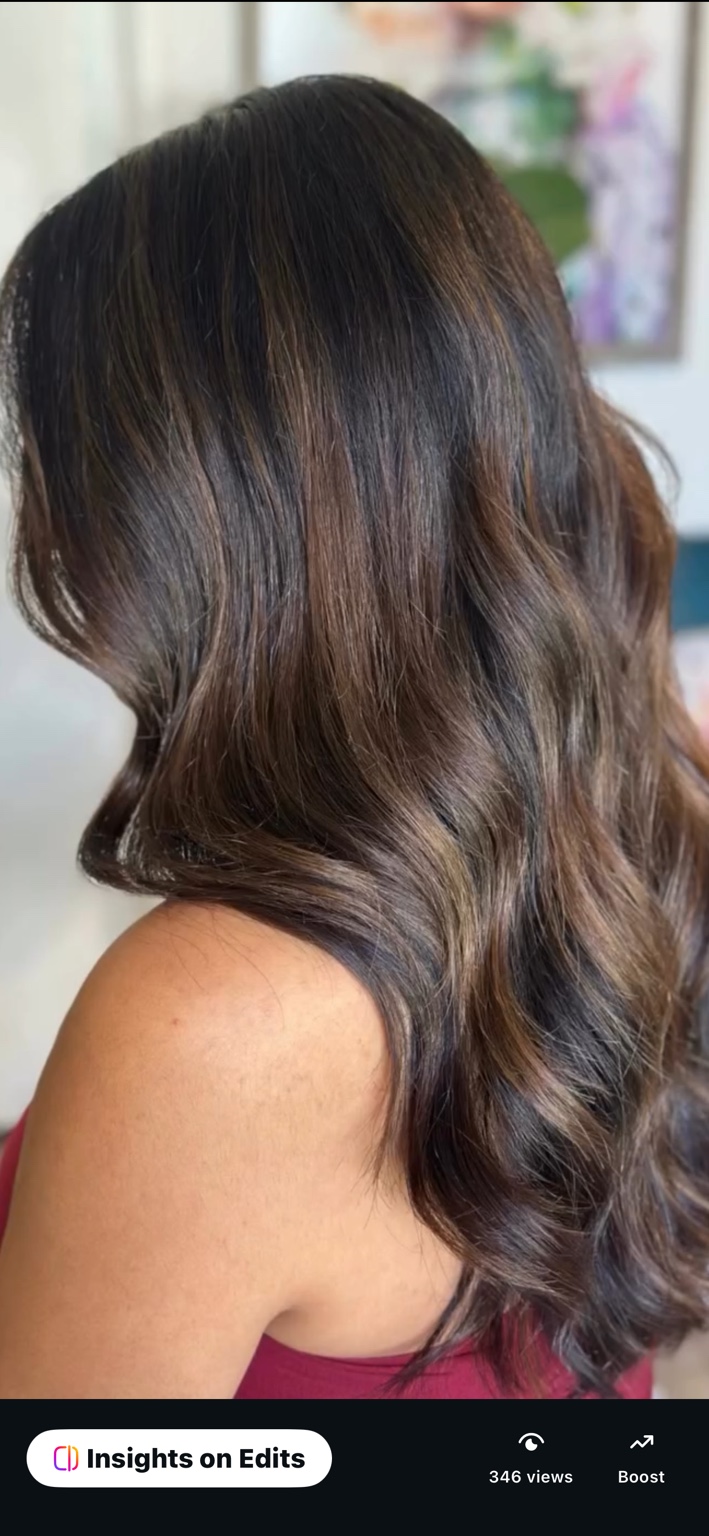 Glossy brunette waves with softly blended highlights, hair by Brandy Michele