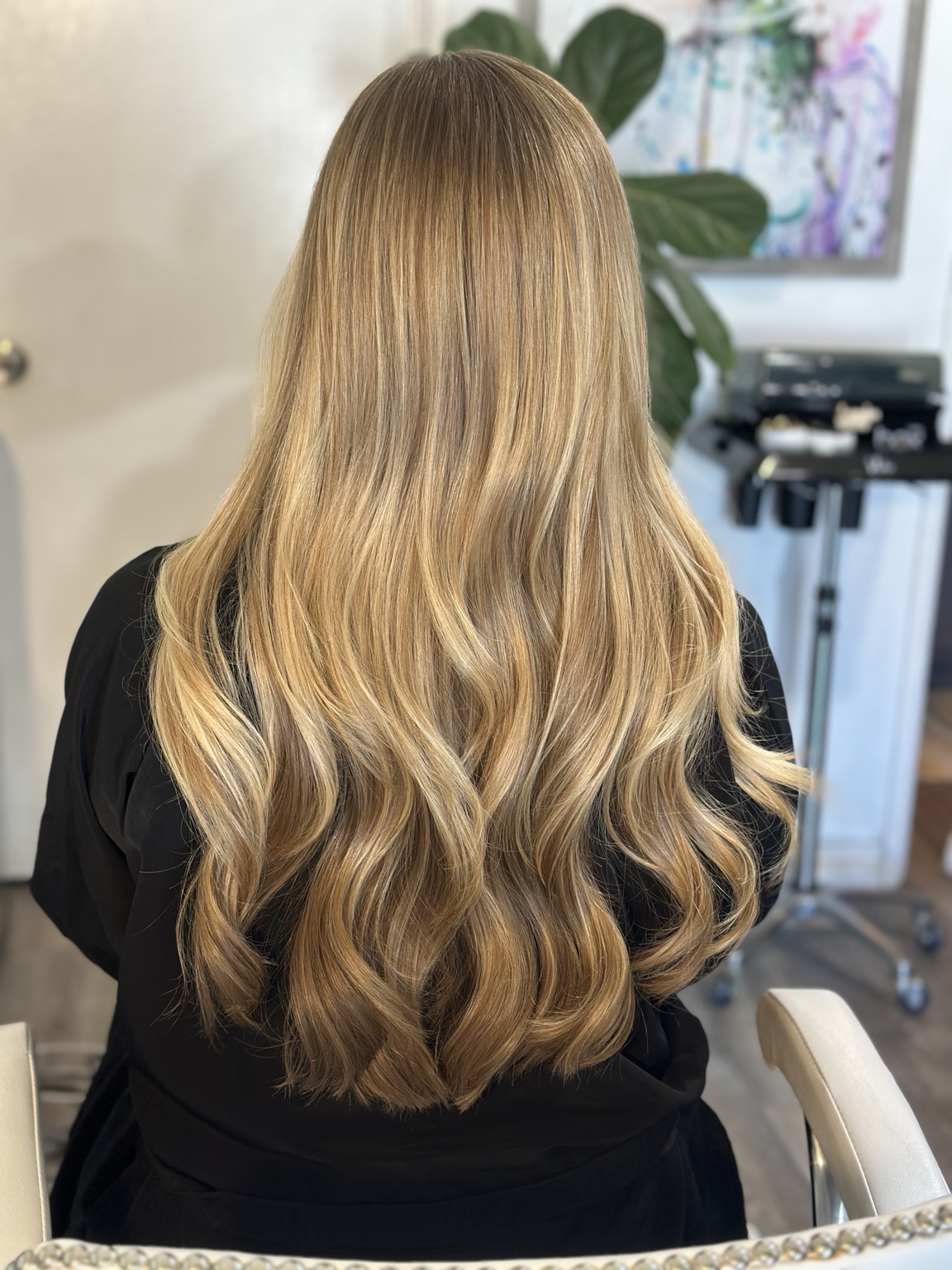 Long golden blonde waves with dimensional highlights, hair by Brandy Michele